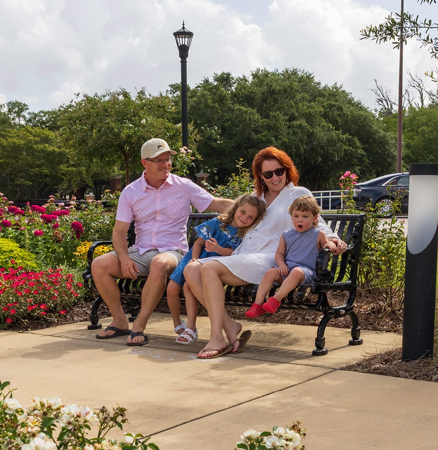 family on downtown bench